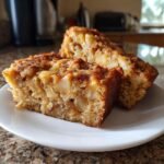 Two slices of Irresistible Hawaiian Banana Bread Recipe, showing chunks of banana and a moist crumb.