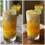 A vibrant Citrus Pineapple Coconut Mocktail layered with crushed ice, yellow pineapple mixture, and white coconut cream, garnished with a lime slice and pineapple wedge.