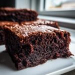 Close-up of a rich, fudgy square of Irresistible Easy Red Bean Brownies on a white plate.