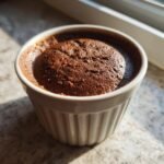 Close-up of a single serving of Irresistible Chocolate Hazelnut Mousse Recipe Delight in a white fluted ramekin.