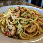 Close-up of Irresistible Shrimp Scampi Linguine tossed in garlic butter sauce and fresh parsley.
